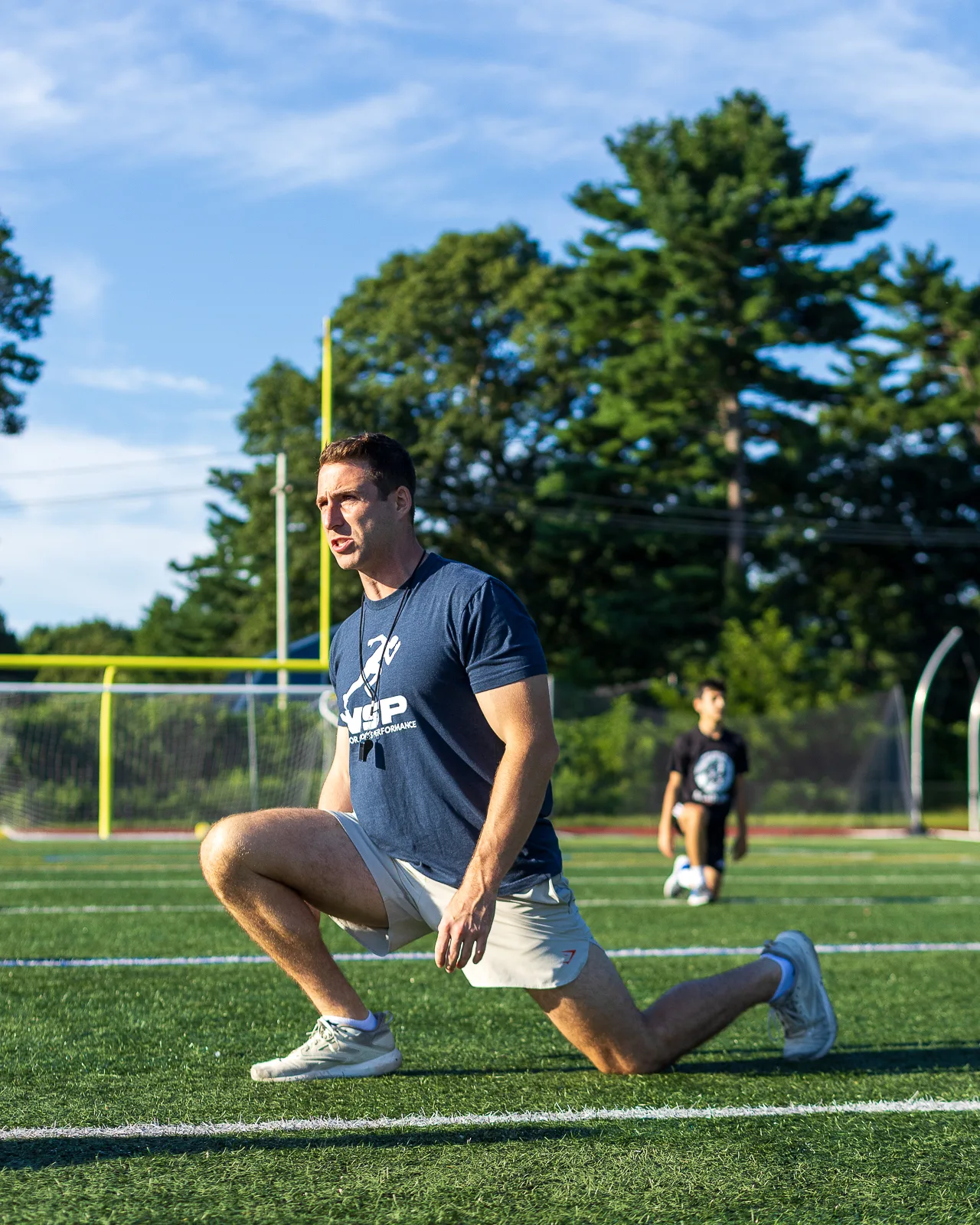 Coach demonstrating a lunge