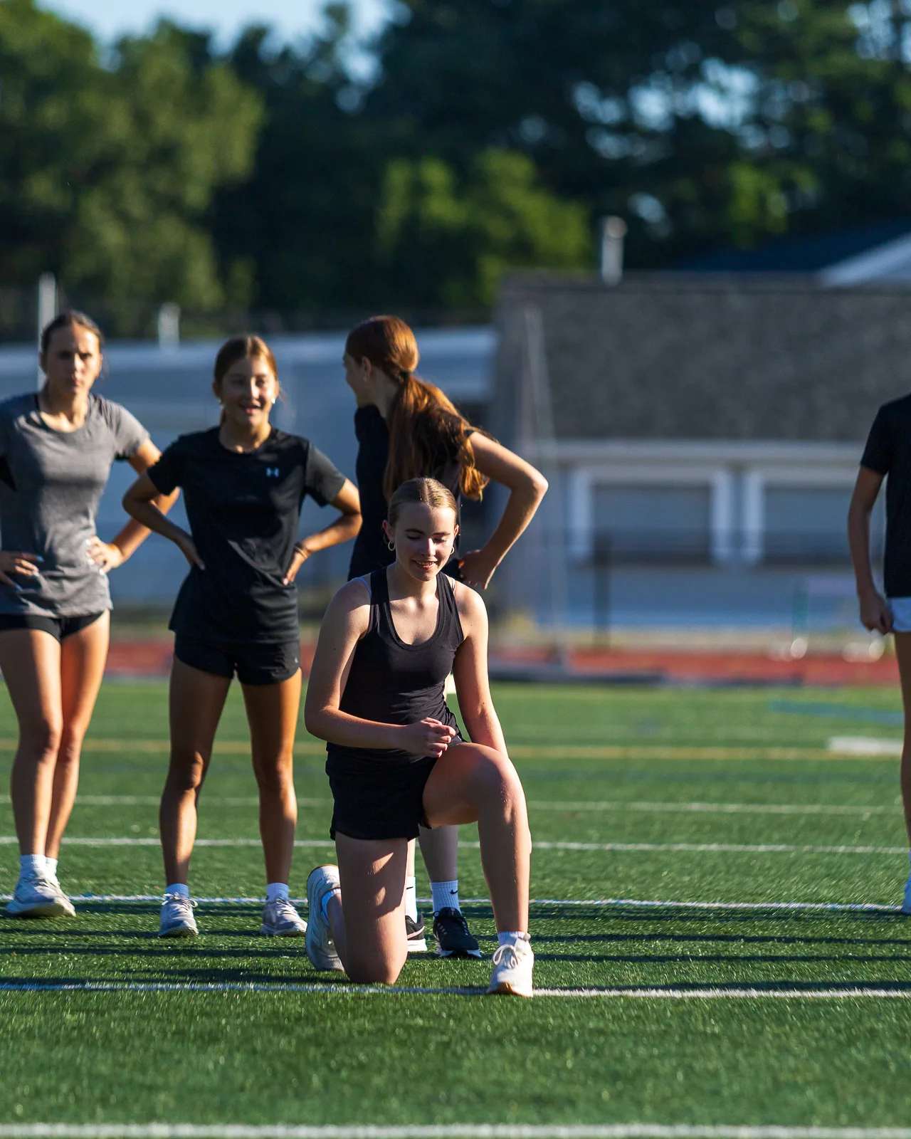 Coach guiding an outdoor drill