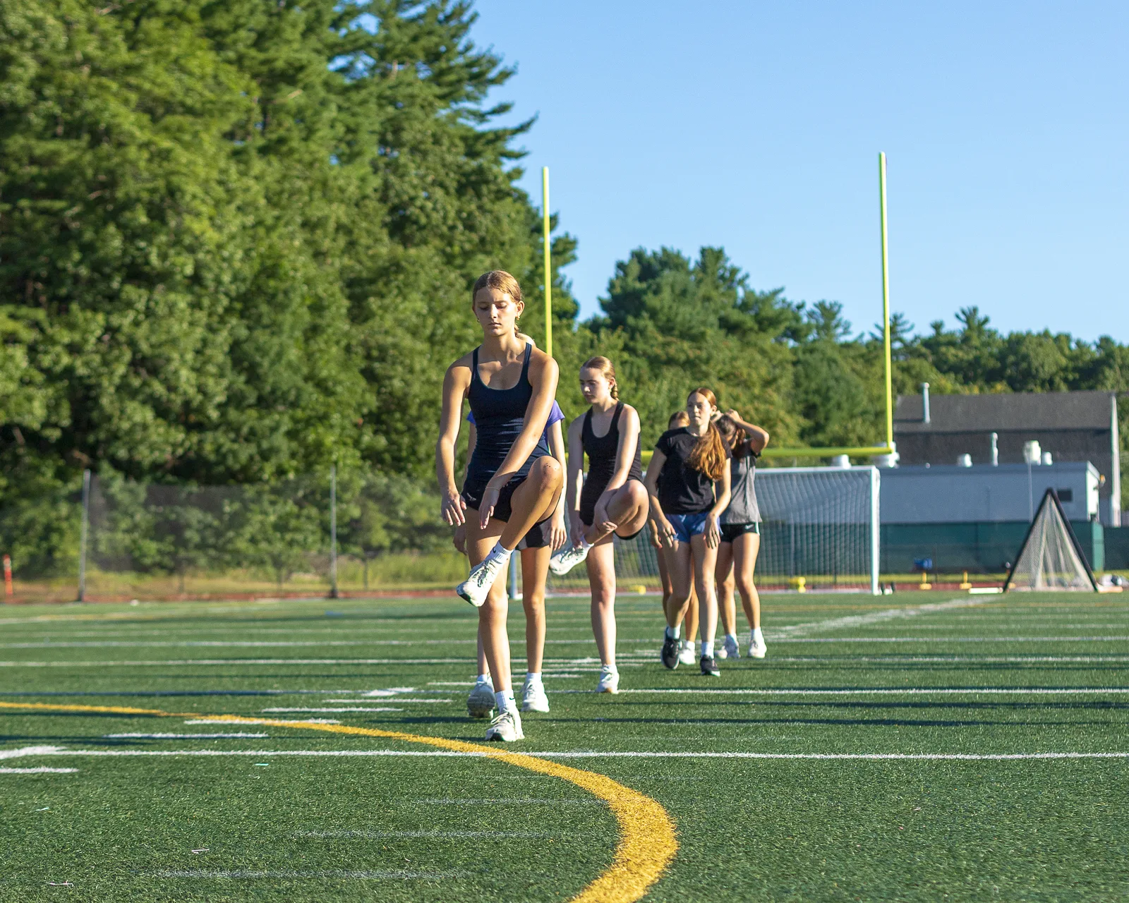 Athletes completing a field drill