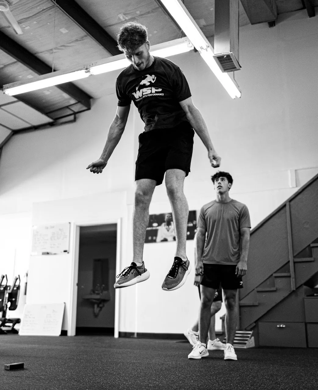 Athlete jumping over a hurdle