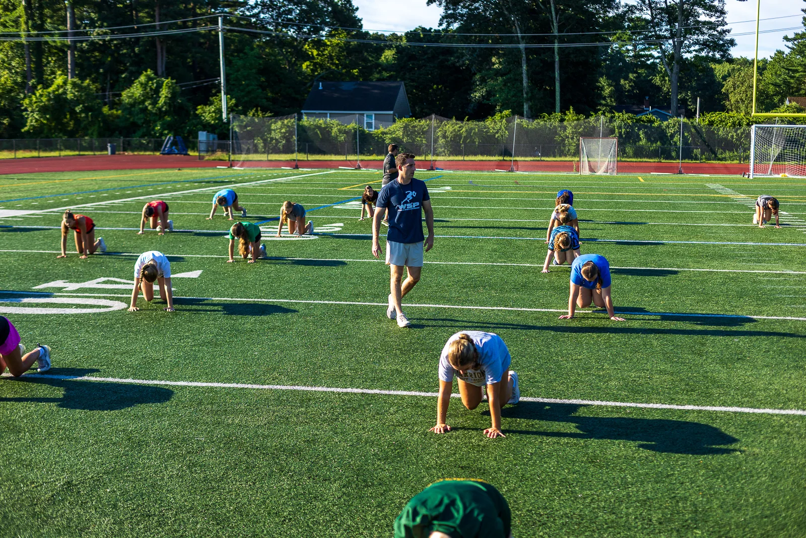 Group warm-up across the field