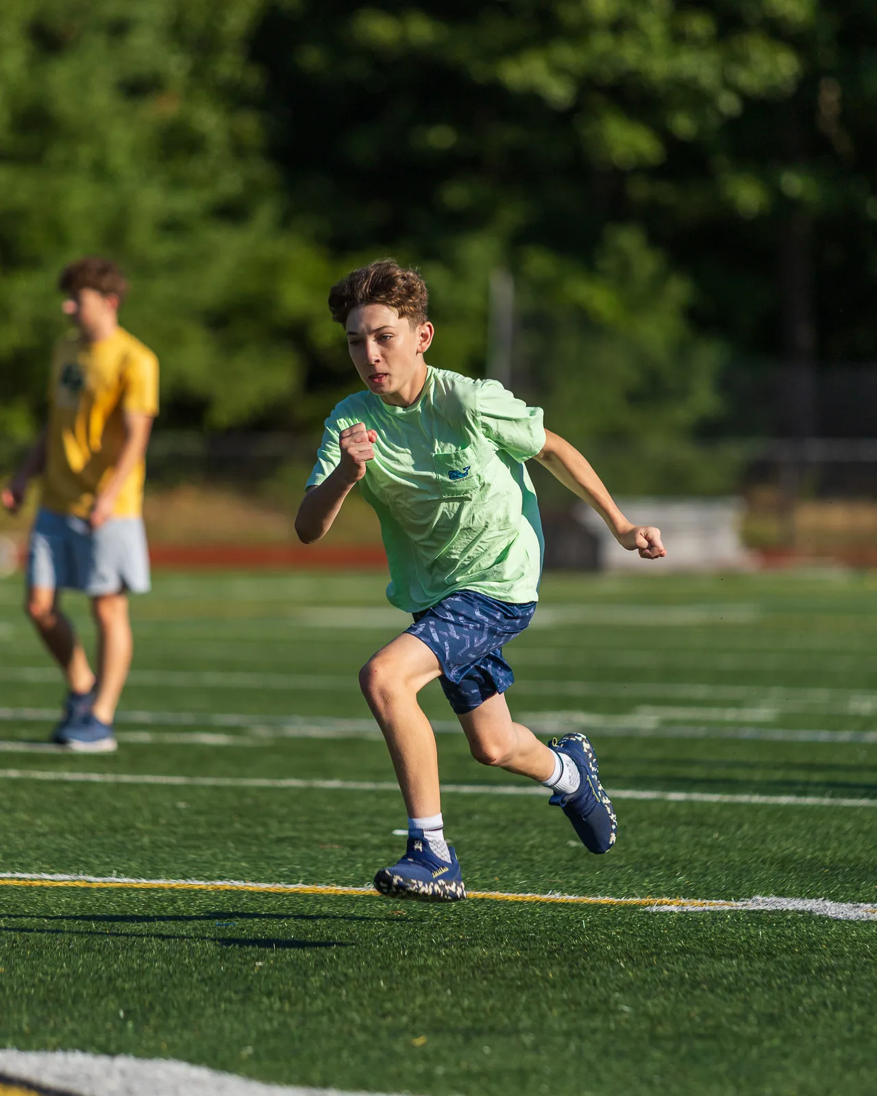 Athlete sprinting across the field