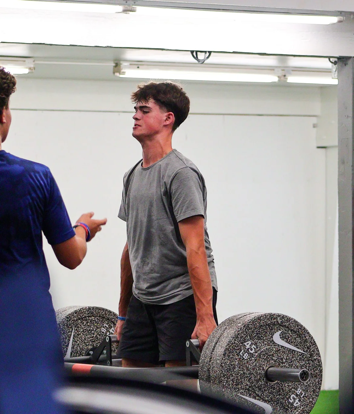 Athlete standing with a loaded trap bar at WSP
