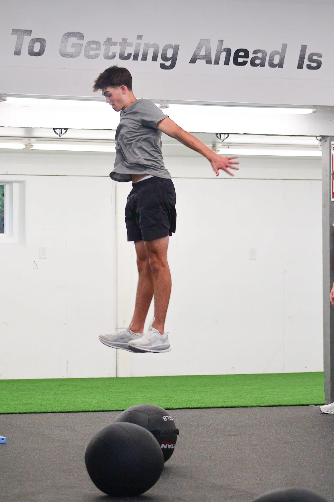 Athlete jumping beside a medicine ball at WSP