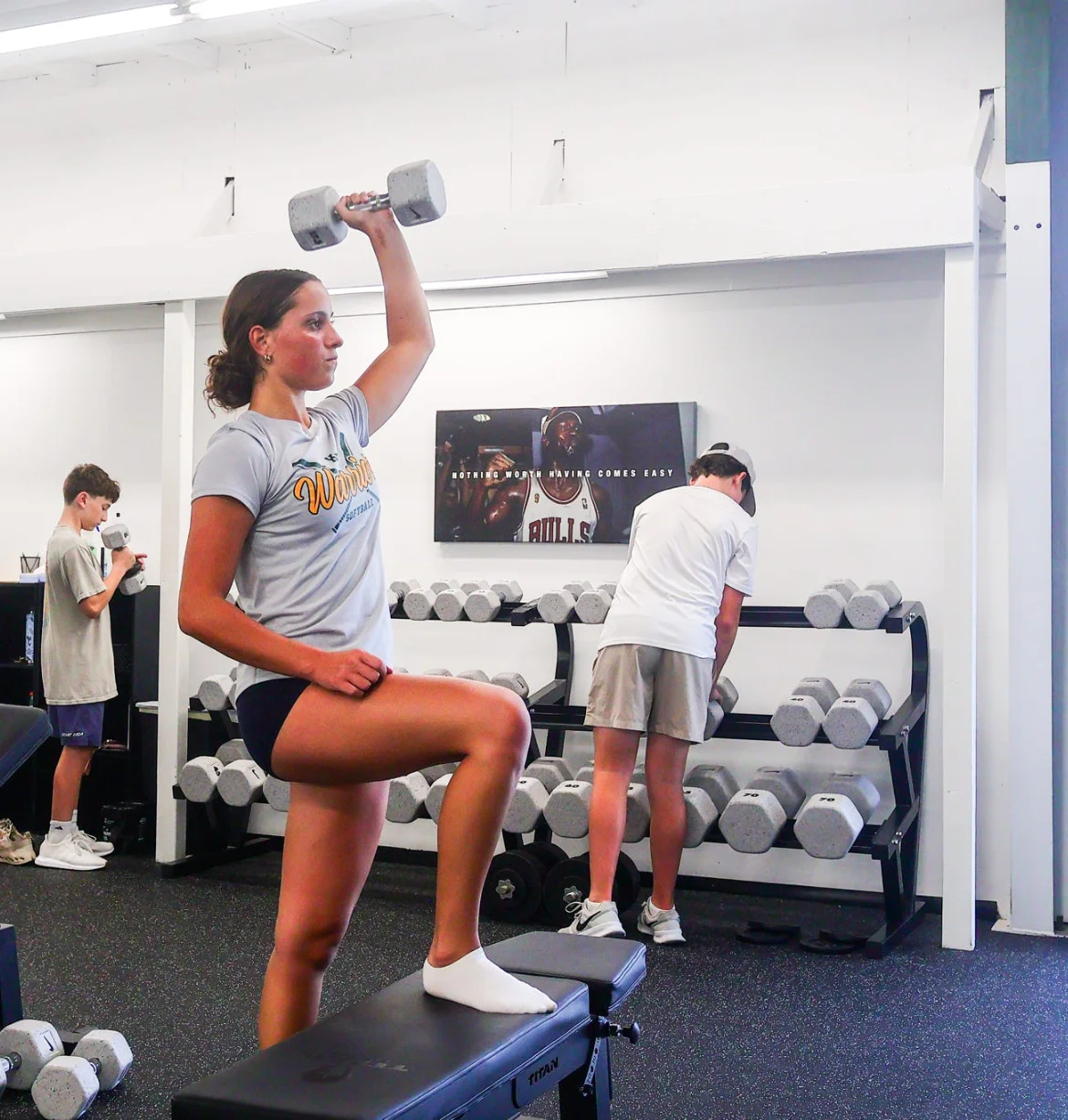 Athlete performing a weighted step-up at WSP